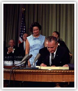 President Lyndon Johnson signs into law amendments to the Social Security Act
